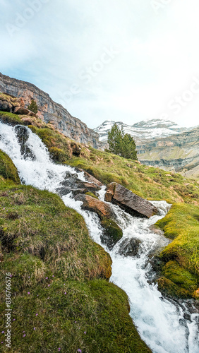 Immersed in the peace of the Ordesa y Monte Perdido National Park, where the waterfall of the Arazas River provides a fascinating spectacle in the Pyrenees of Aragon, surrounded by beech