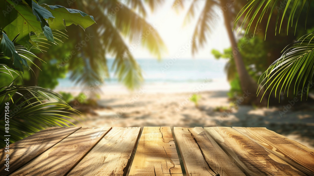 Empty wooden table surrounded by palm leaves on a summer beach. Empty wooden table surrounded by palm leaves on a summer beach.