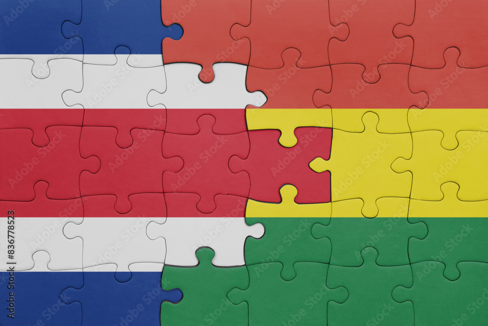 puzzle with the colourful national flag of bolivia and flag of costa rica . puzzle with the colourful national flag of bolivia and flag of costa rica .