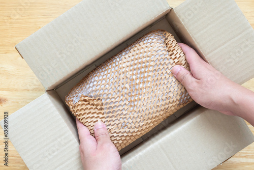 Eco friendly brown paper honeycomb wrap for product packaging parcel carton box photo