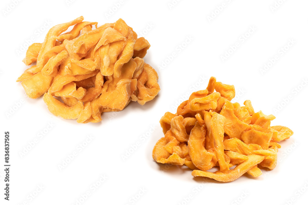 Dried melon slices isolated on a white background.