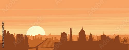 Brown panoramic poster of the city skyline with misty background buildings, sunrise, clouds and mountains of BUENOS AIRES, ARGENTINA