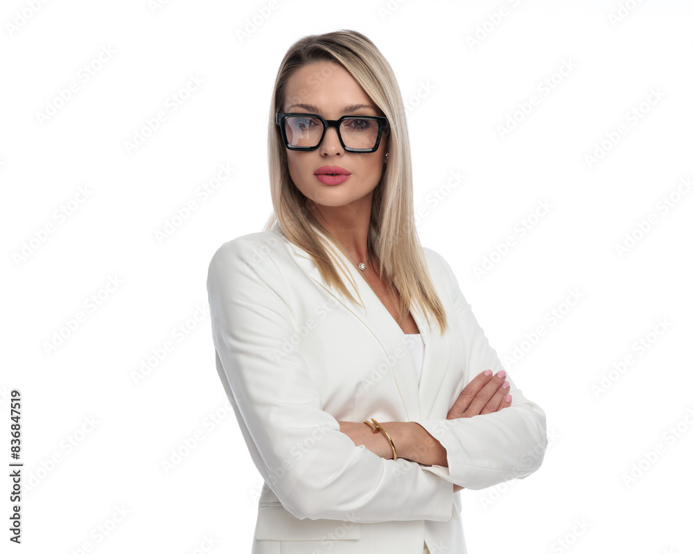 portrait of young blonde businesswoman holding arms crossed portrait of young blonde businesswoman holding arms crossed