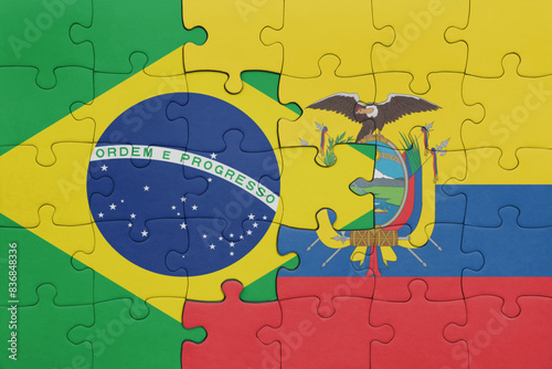 puzzle with the colourful national flag of ecuador and flag of brazil .