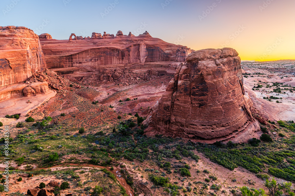The Upper Delicate Arch Viewpoint in Arches national Park near Moab in Utah early in the morning dawn. The Upper Delicate Arch Viewpoint in Arches national Park near Moab in Utah early in the morning dawn.