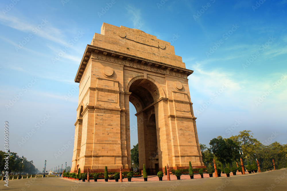 Fototapeta premium Magnificent structure of India Gate against blue sky. The India Gate is a war memorial located near the Kartavya path of New Delhi, formerly called Rajpath.