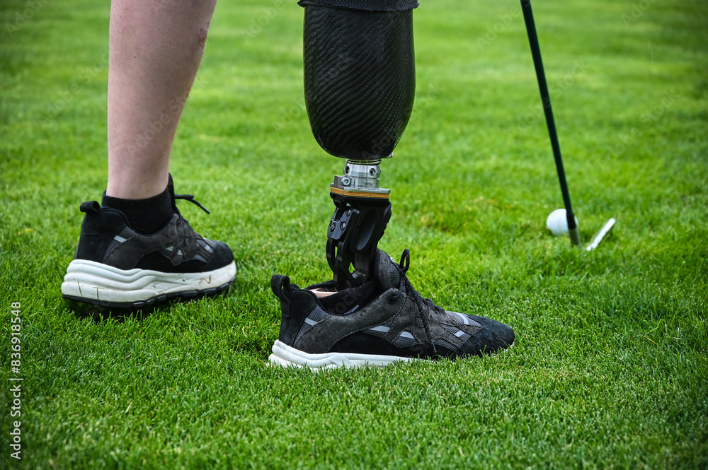man playing golf on a prosthesis