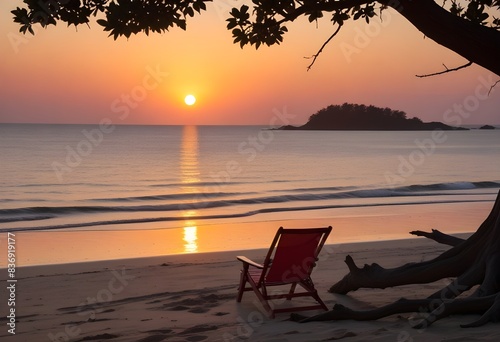 A scenic sunset over the ocean  with a silhouetted island in the distance  in the foreground  there is a red beach chair on the sandy shore  framed by the branches of a tree