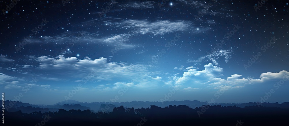 Panoramic view of the night sky with a moon in the background, offering a serene landscape with a copy space image.