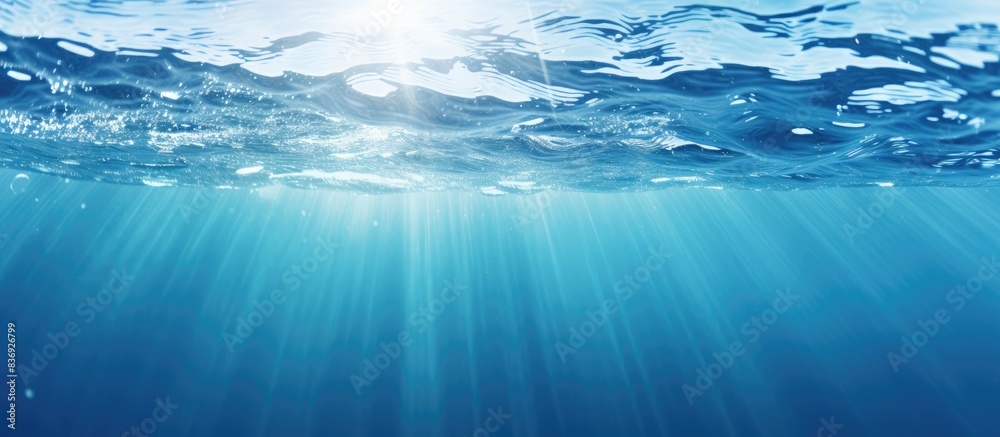 Blurry blue clear water with ripples and bubbles, featuring a shining pattern texture background, ideal for a copy space image. Blurry blue clear water with ripples and bubbles, featuring a shining pattern texture background, ideal for a copy space image.