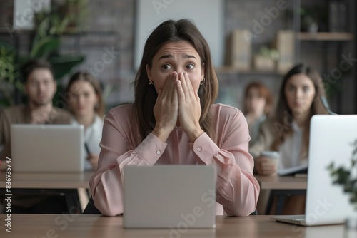 Shy female employee embarrassed and nervous during public speaking. photo