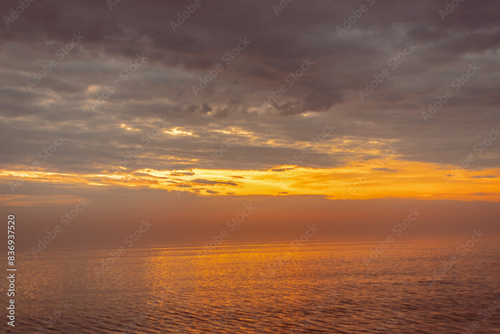 Baltic sea covered with fog after rain during the sunset at summer