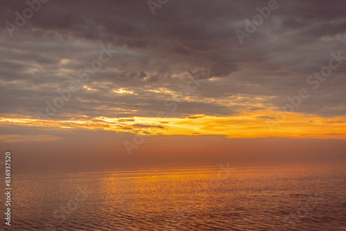 Baltic sea covered with fog after rain during the sunset at summer