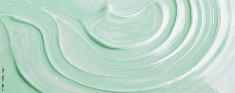 Green liquid top view. Water surface with gentle ripples and concentric rings, capturing the serene and refreshing essence of calm water Green liquid top view. Water surface with gentle ripples and concentric rings, capturing the serene and refreshing essence of calm water