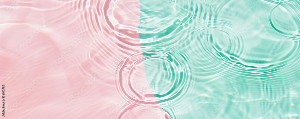 Obraz premium turquoise mint pink Water surface with gentle ripples and concentric rings, capturing the serene and refreshing essence of calm water