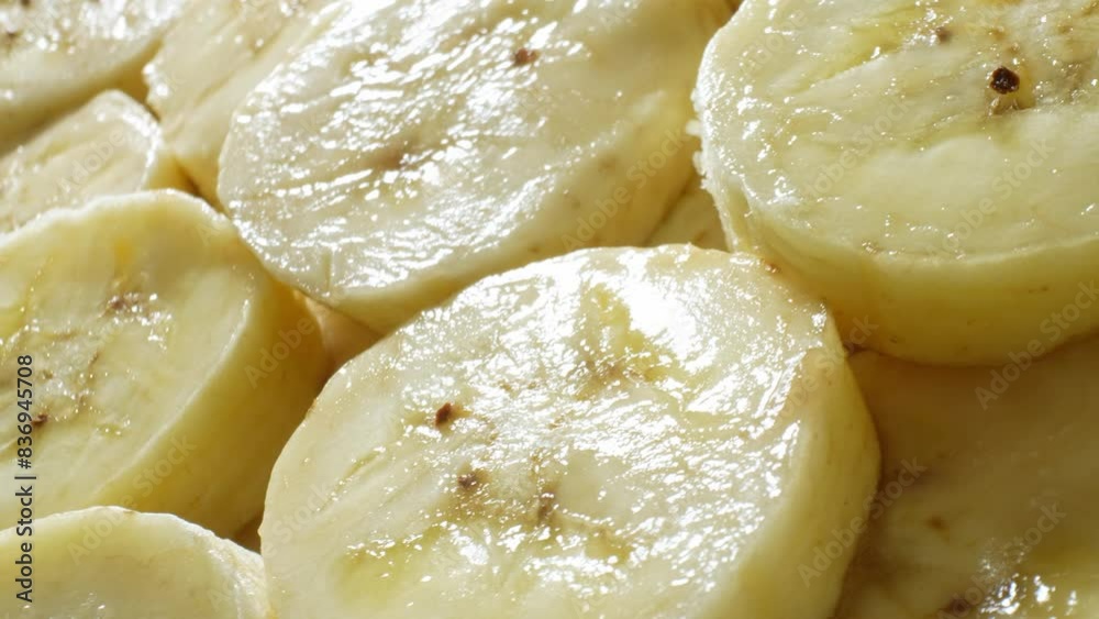 Behold the precision-cut slices of banana, unveiling their luscious creaminess speckled with golden-brown accents. Soft to the touch, with a subtle sheen, they beckon with irresistible allure.
Behold the precision-cut slices of banana, unveiling their luscious creaminess speckled with golden-brown accents. Soft to the touch, with a subtle sheen, they beckon with irresistible allure.