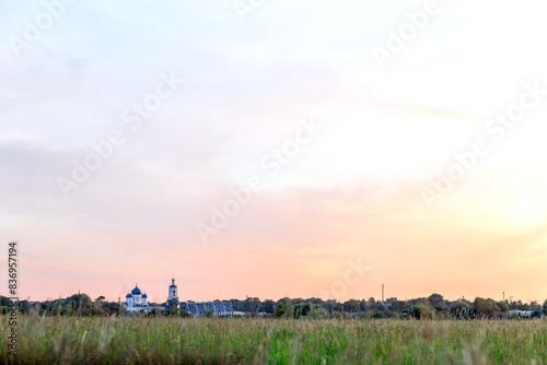 Ancient Holy Bogolyubsky Monastery on high bank of the pond. Bogolyubovo, Vladimir region, Russia photo