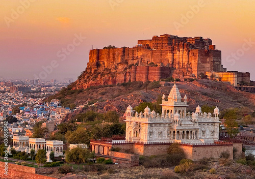 Warm sunset hues bathe the historic mehrangarh fort with the jodhpur cityscape in india photo