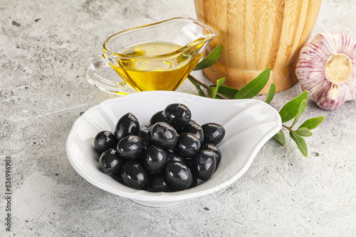 Black olives with oil and branch