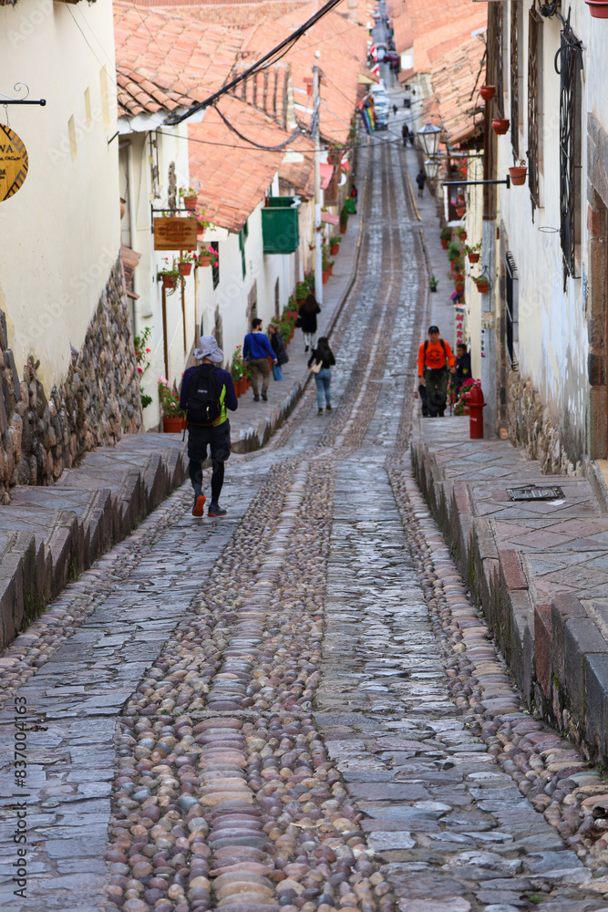 Picturesque long, narrow street in Cusco, Peru Picturesque long, narrow street in Cusco, Peru