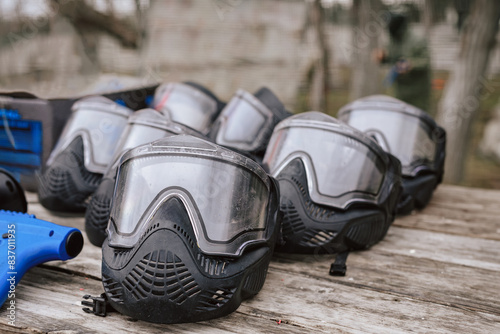 Row of paintball safety helmets lined up for tactical play