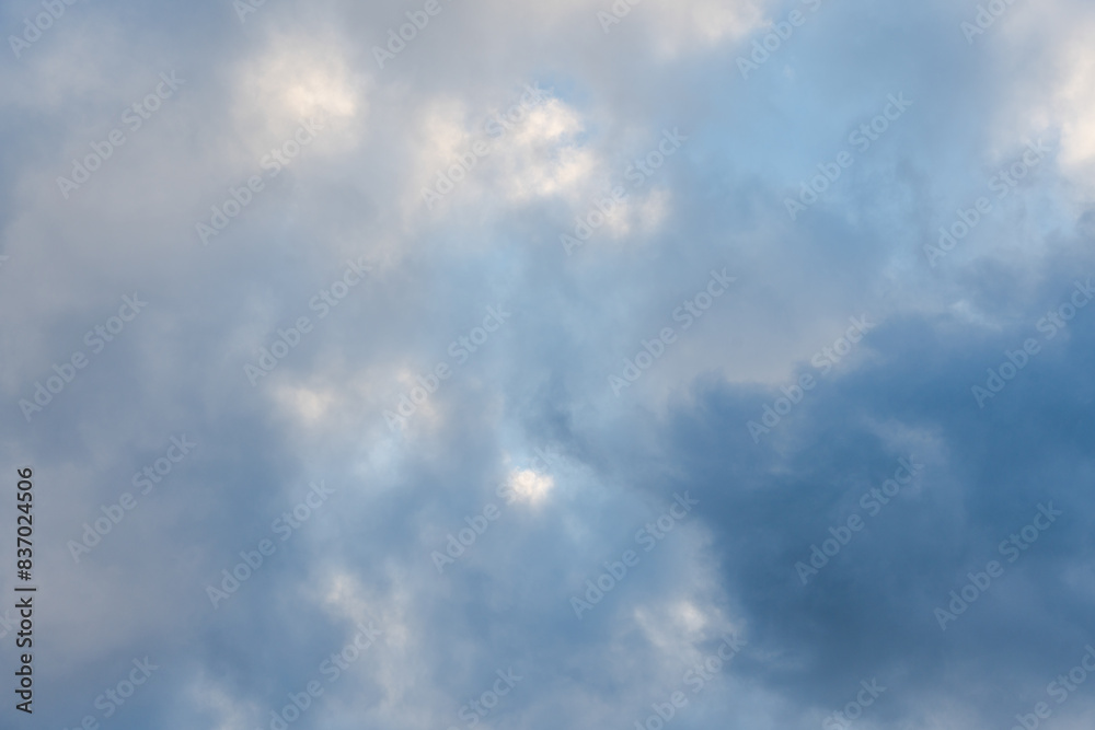 Fototapeta premium Dramatic sky with dark clouds and hints of sunlight