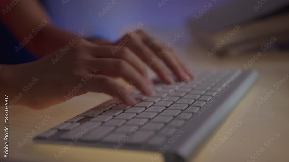 Close up of hands of person typing email on wireless keyboard while working on computer, time lapse Close up of hands of person typing email on wireless keyboard while working on computer, time lapse