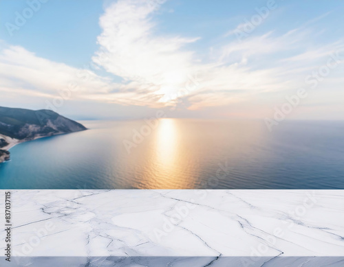 A white marble tabletop overlooking the sea with mountanis in a sunny summer day. Mockup, space for your product	 photo