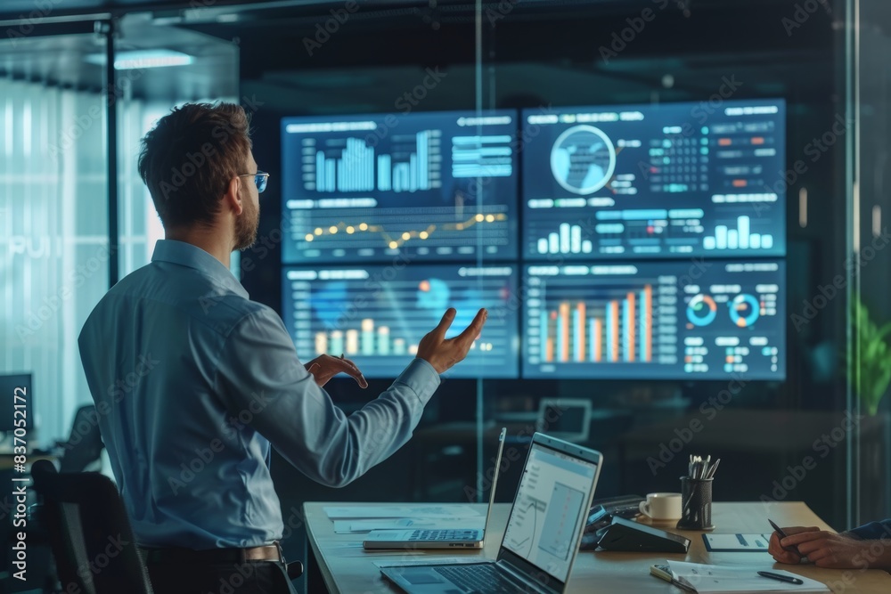 Project Manager Presenting Status Report with Charts and Data Visualizations in Modern Office Project Manager Presenting Status Report with Charts and Data Visualizations in Modern Office