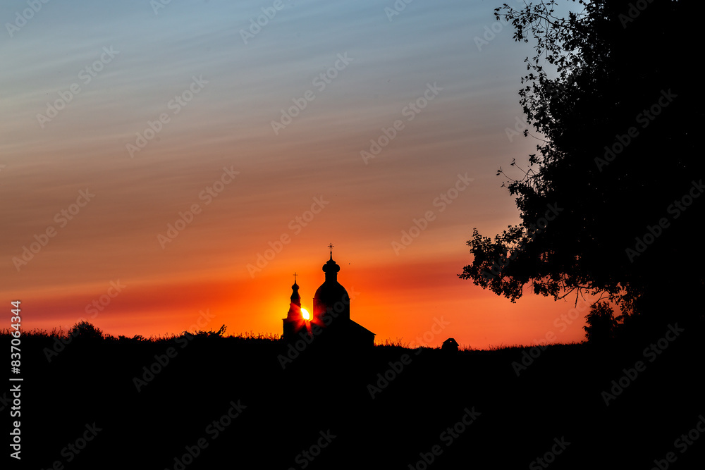 Suzdal, Vladimir region, Russia, Golden Ring: View of the Church of Elijah the Prophet of the Ilyinsky Parish from the Suzdal Kremlin on a warm summer evening. Suzdal, Vladimir region, Russia, Golden Ring: View of the Church of Elijah the Prophet of the Ilyinsky Parish from the Suzdal Kremlin on a warm summer evening.