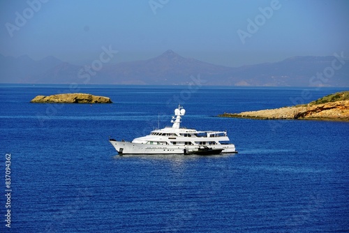 A luxury yacht off the coast of Vouliagmeni in Attica, Greece photo