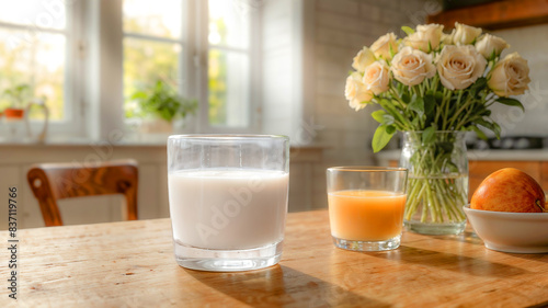 Glass of almond milk with almond seed on rustic wooden table. World Milk Day concept.