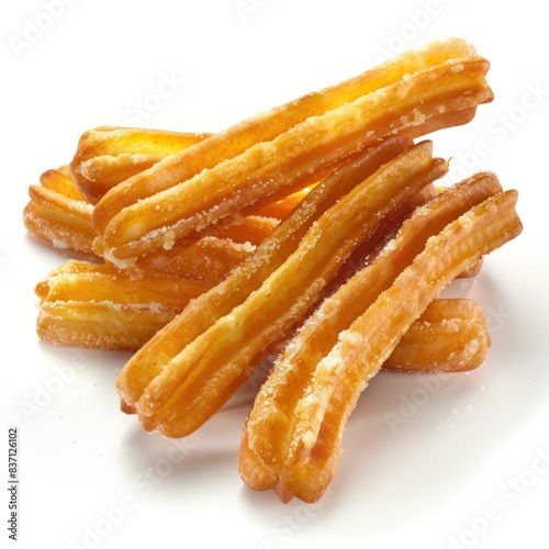 Close-up of golden-brown Spanish Churros against a pristine white backdrop.