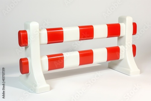 A white and red striped barrier with a red and white stripe. The barrier is made of plastic and is placed on a white surface