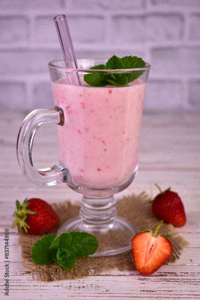 Strawberry banana smoothie in a tall glass. Close-up.
Strawberry banana smoothie in a tall glass. Close-up.