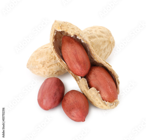 Fresh unpeeled peanuts isolated on white. Healthy snack