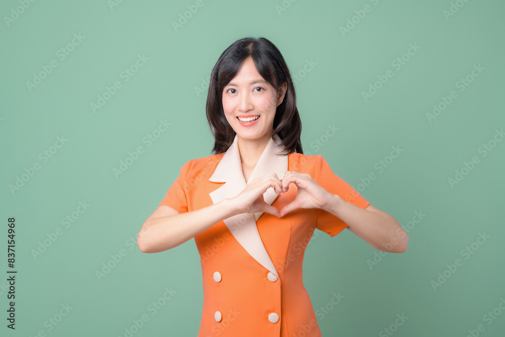 Woman making heart shape with both hands Woman making heart shape with both hands