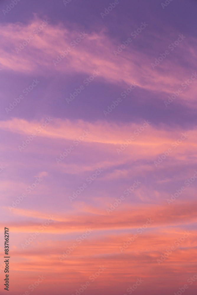 Dramatic soft sunrise, sunset pink violet orange sky with cirrus clouds background texture Dramatic soft sunrise, sunset pink violet orange sky with cirrus clouds background texture