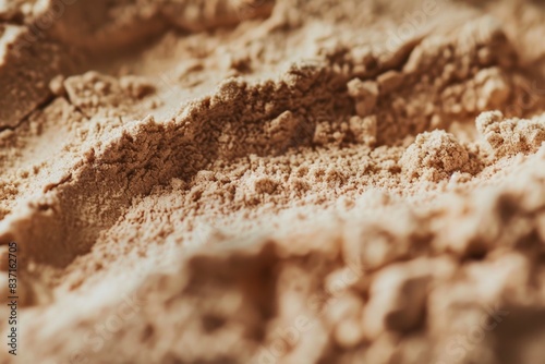 A detailed closeup image showcasing a whey protein powder, emphasizing the texture and color of the supplement © Vladyslav  Andrukhiv
