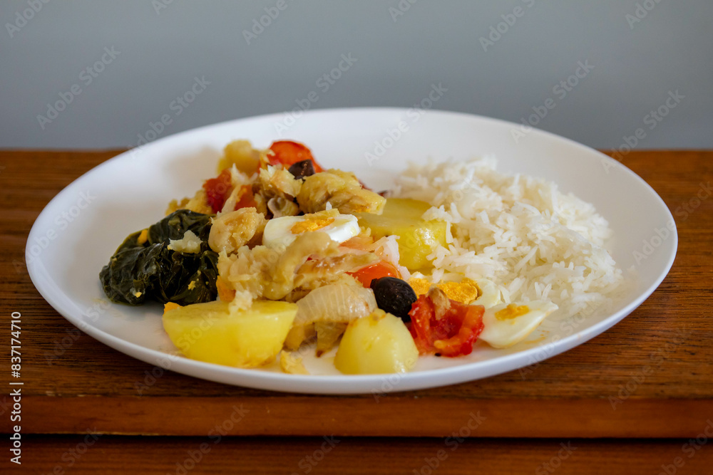 Traditional Portuguese bacalhoada with classic ingredients. When cod Oven Traditional Portuguese bacalhoada with classic ingredients. When cod Oven