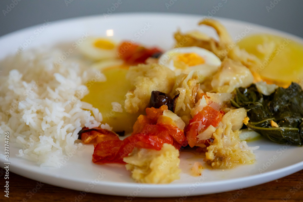 Traditional Portuguese bacalhoada with classic ingredients. When cod Oven Traditional Portuguese bacalhoada with classic ingredients. When cod Oven