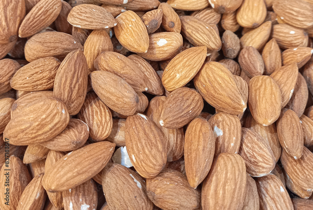 Peeled almond nuts as a background Peeled almond nuts as a background