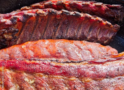 Smoked pork side ribs taken off the heat, close-up