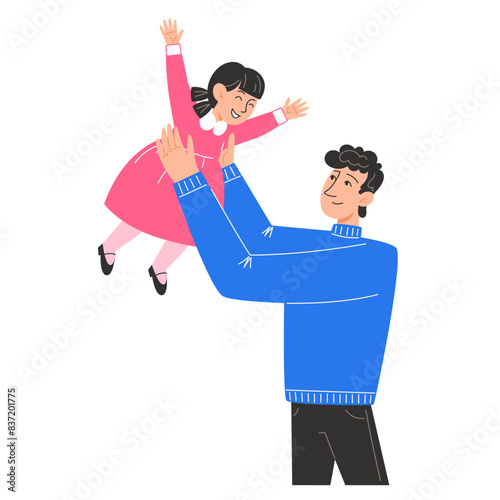 A young father holds his little daughter in his arms
