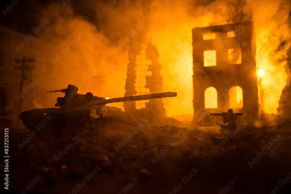 Fototapeta premium War Concept. Military silhouettes fighting scene on war fog sky background, World War Soldiers Silhouette Below Cloudy Skyline At night. Battle in ruined city.