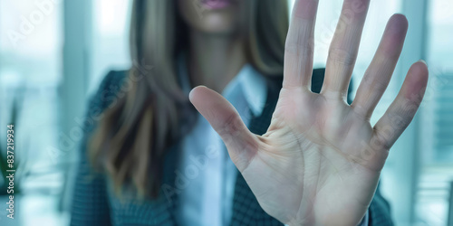 Stop, hand sign and woman in business suit with no gesture for sexual harassment and violence in office workplace photo