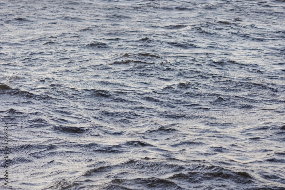 Background image: Sea water surface texture with small waves. Background image: Sea water surface texture with small waves.