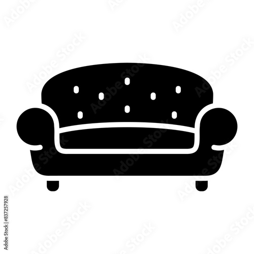 Soft sofa vector icon. Furniture sign