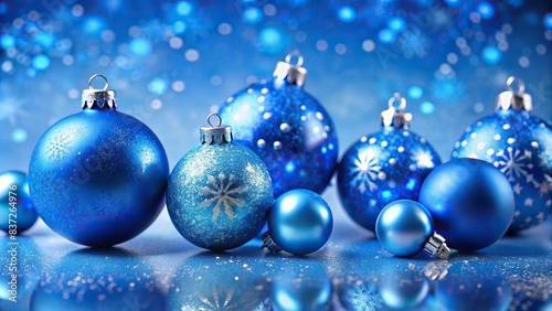Blue christmas ornaments on a matching blue background  perfect for a festive greeting card or banner
