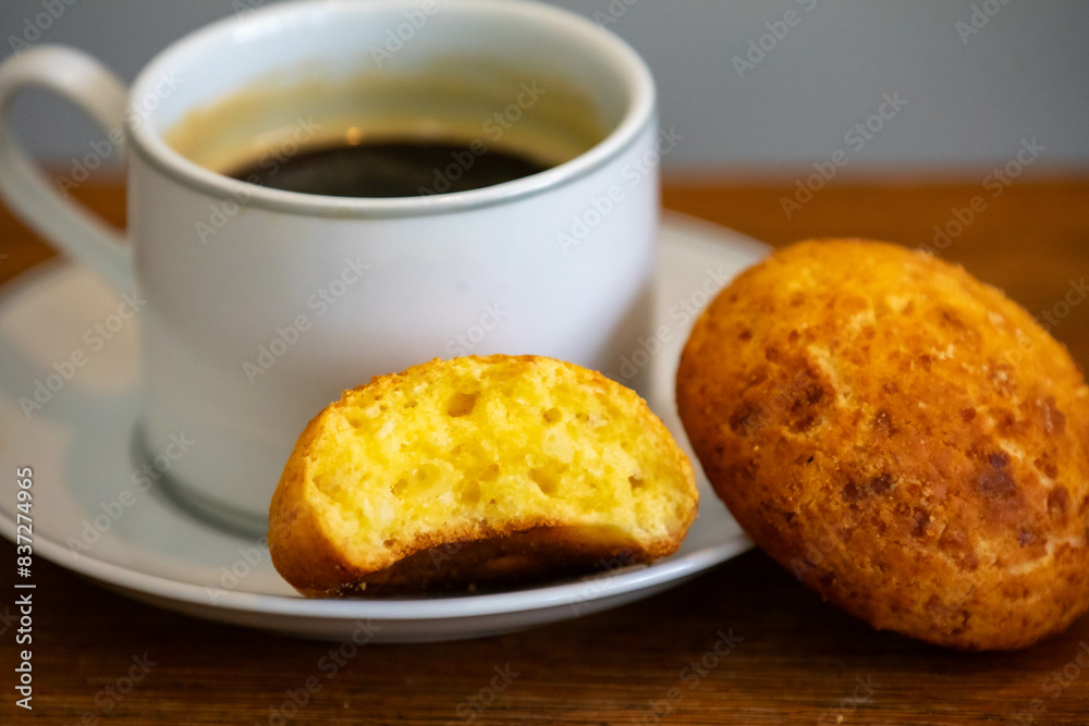 Afternoon coffee served in a white cup with cornbread or cheese bread Afternoon coffee served in a white cup with cornbread or cheese bread